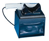 Small UV darkroom with hand lamp.